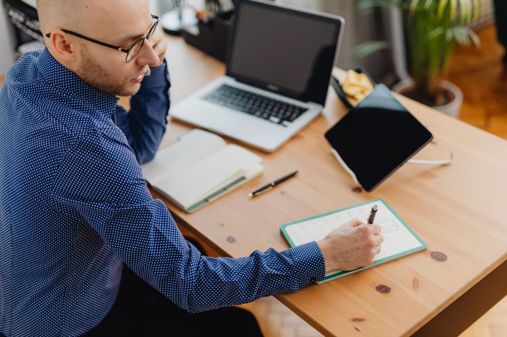 A student freelancer managing multiple clients sitting on the chair